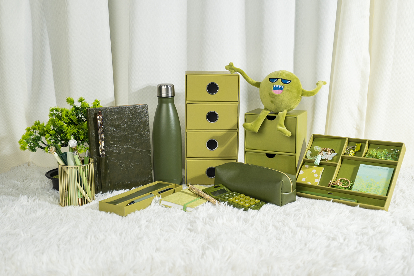 Green coordinated notebooks, desk storage, cases and stationery accessories.