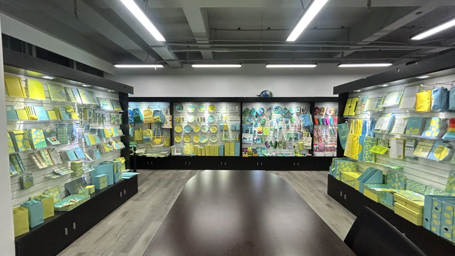 Yellow and blue stationery and bag ranges in the SHINYYOU showroom.