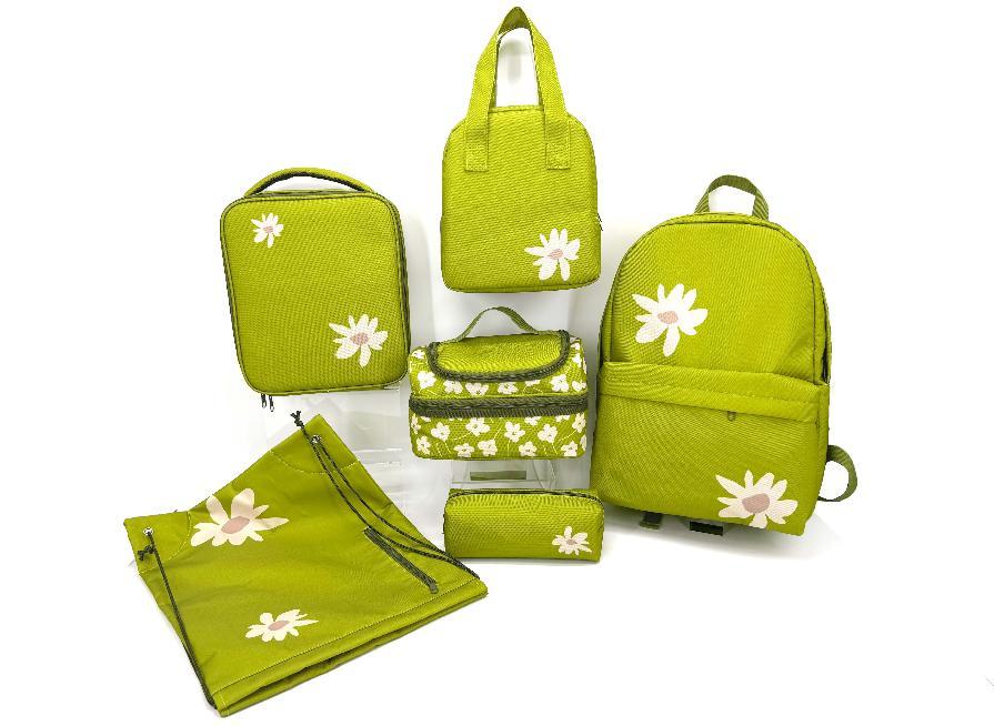 Coordinated green daisy bags, lunch bags and pencil cases.